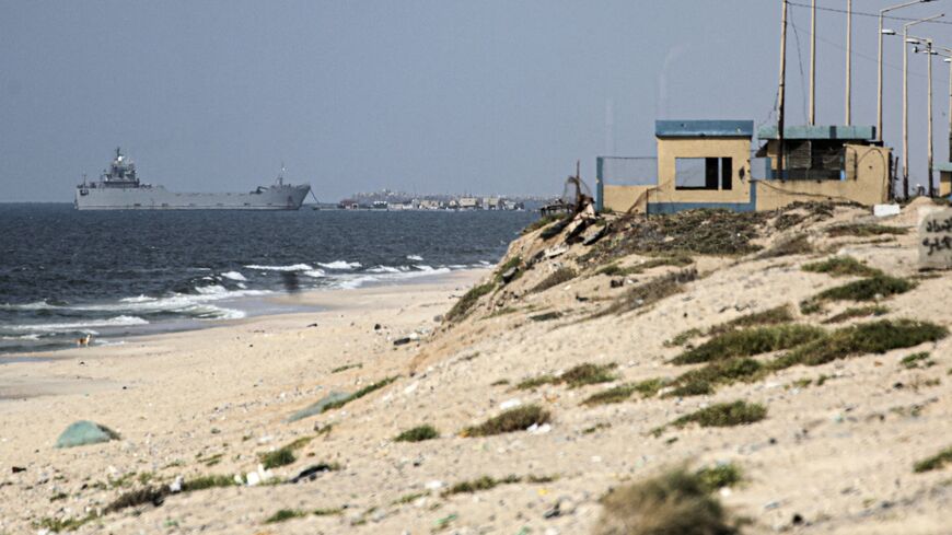 A ship transporting international humanitarian aid is moored at the US-built Trident Pier near Nuseirat in the central Gaza Strip on May 21, 2024, amid the ongoing conflict between Israel and the Palestinian militant Hamas group. 